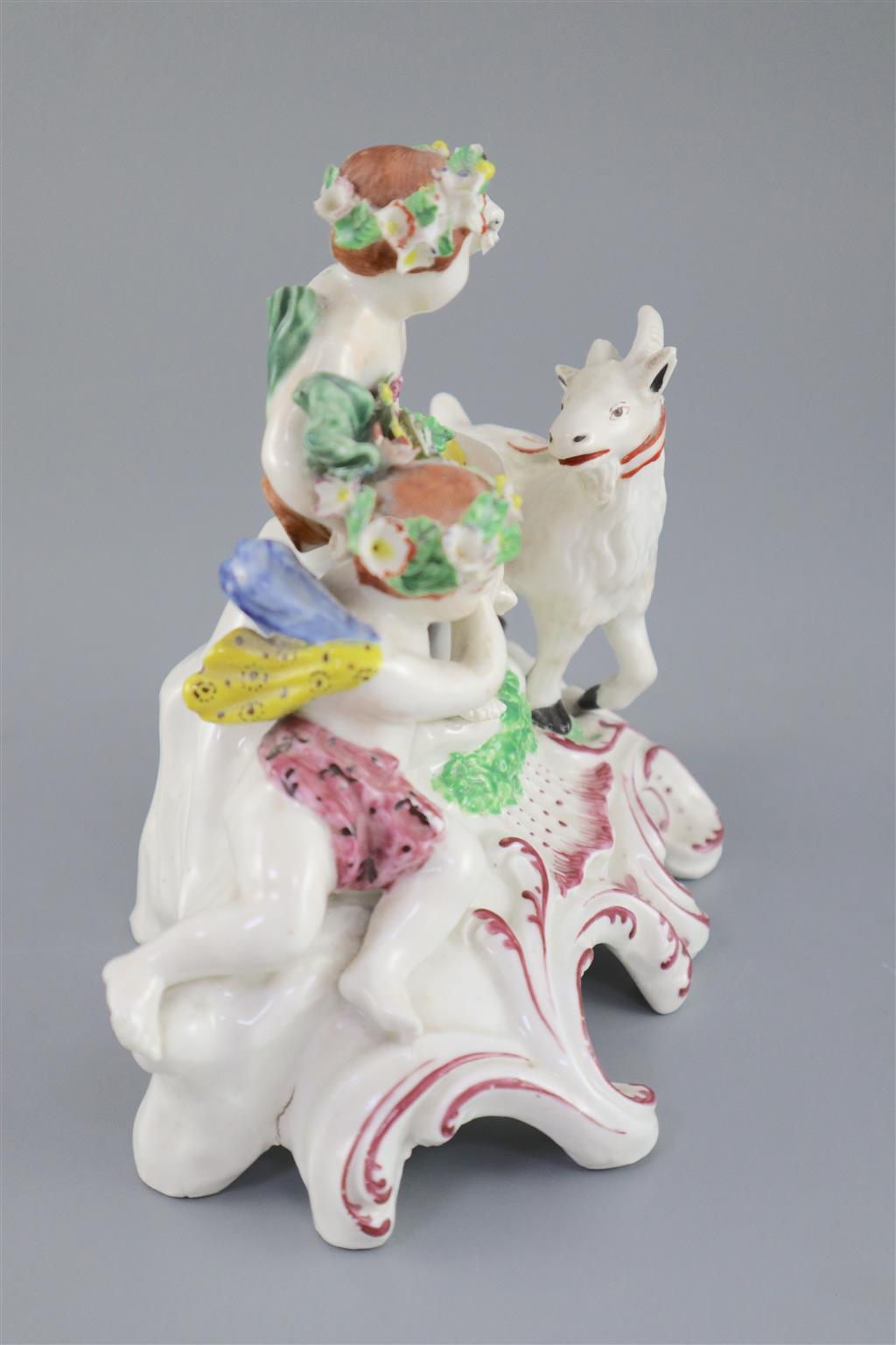 A Vauxhall porcelain group of two Bacchanalian cherubs and a goat, c.1760-5, 14.5cm high